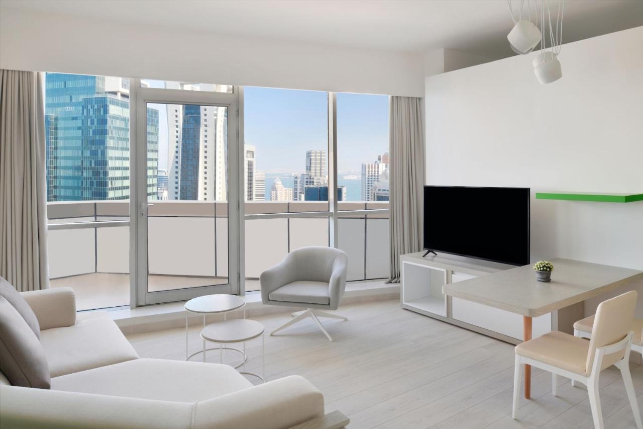 Element By Westin West Bay Doha Hotell Eksteriør bilde A living room in a condominium